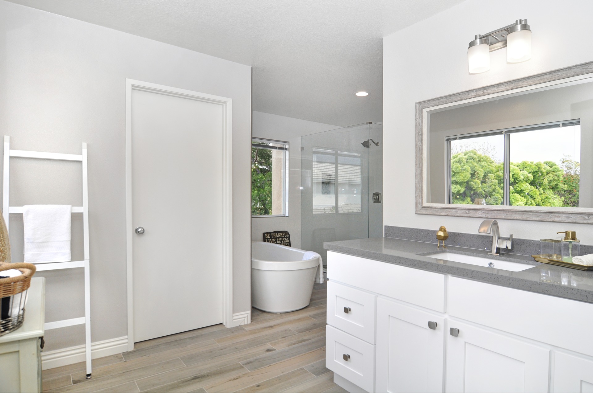Remodeled bathroom in white and gray on the One Stop Plumbing page for Plumbing Remodeling