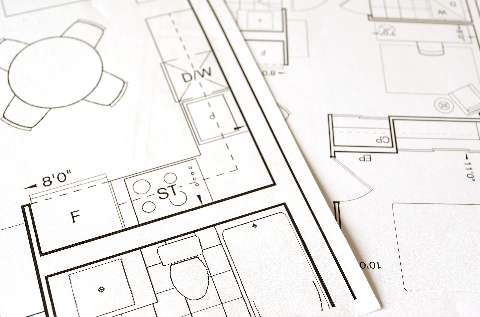 Black and white architectural floor plans showing a kitchen and bathroom on the One Stop Plumbing page for Plumbing Remodeling