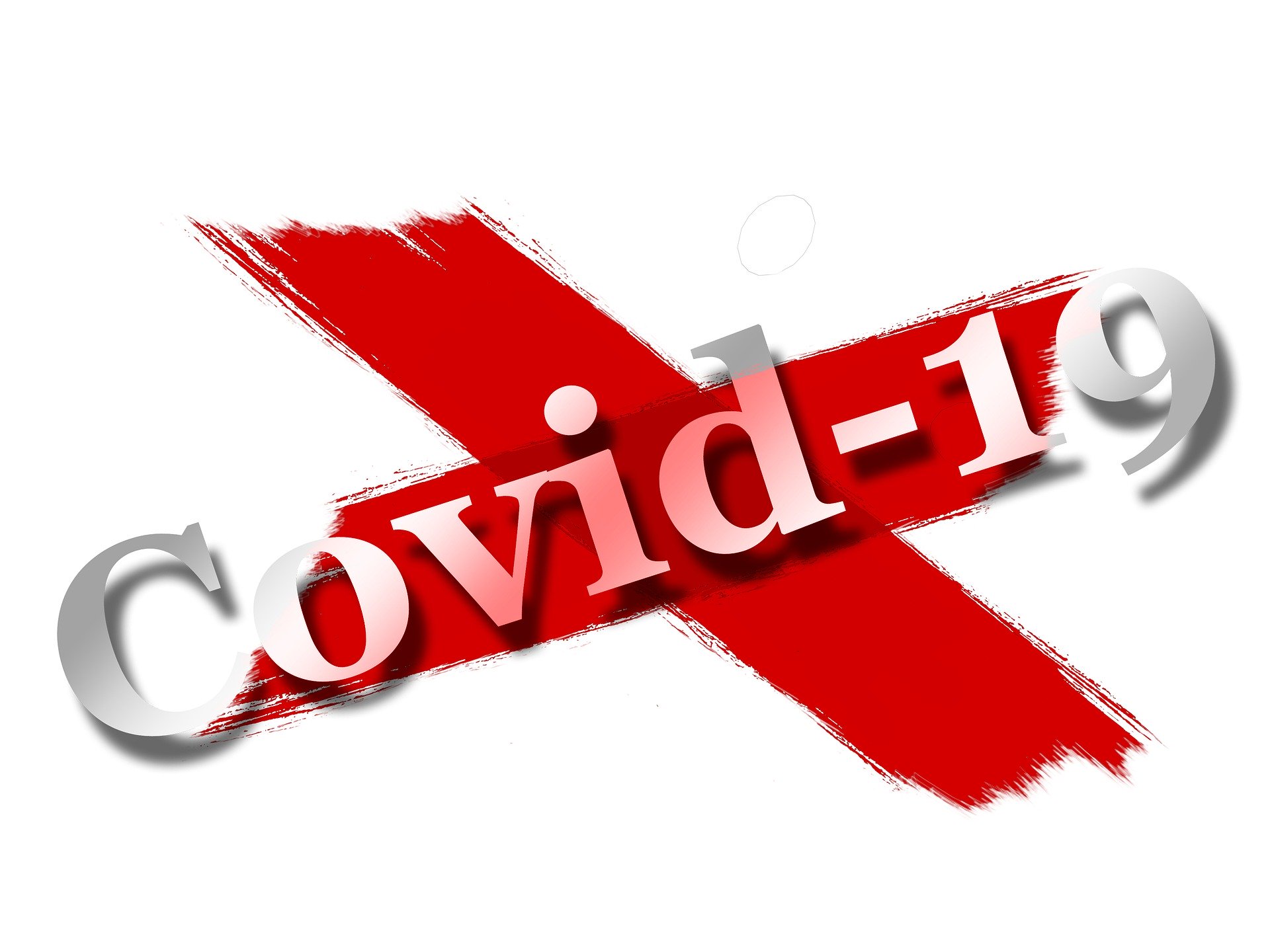 Covid-19 words on a red x